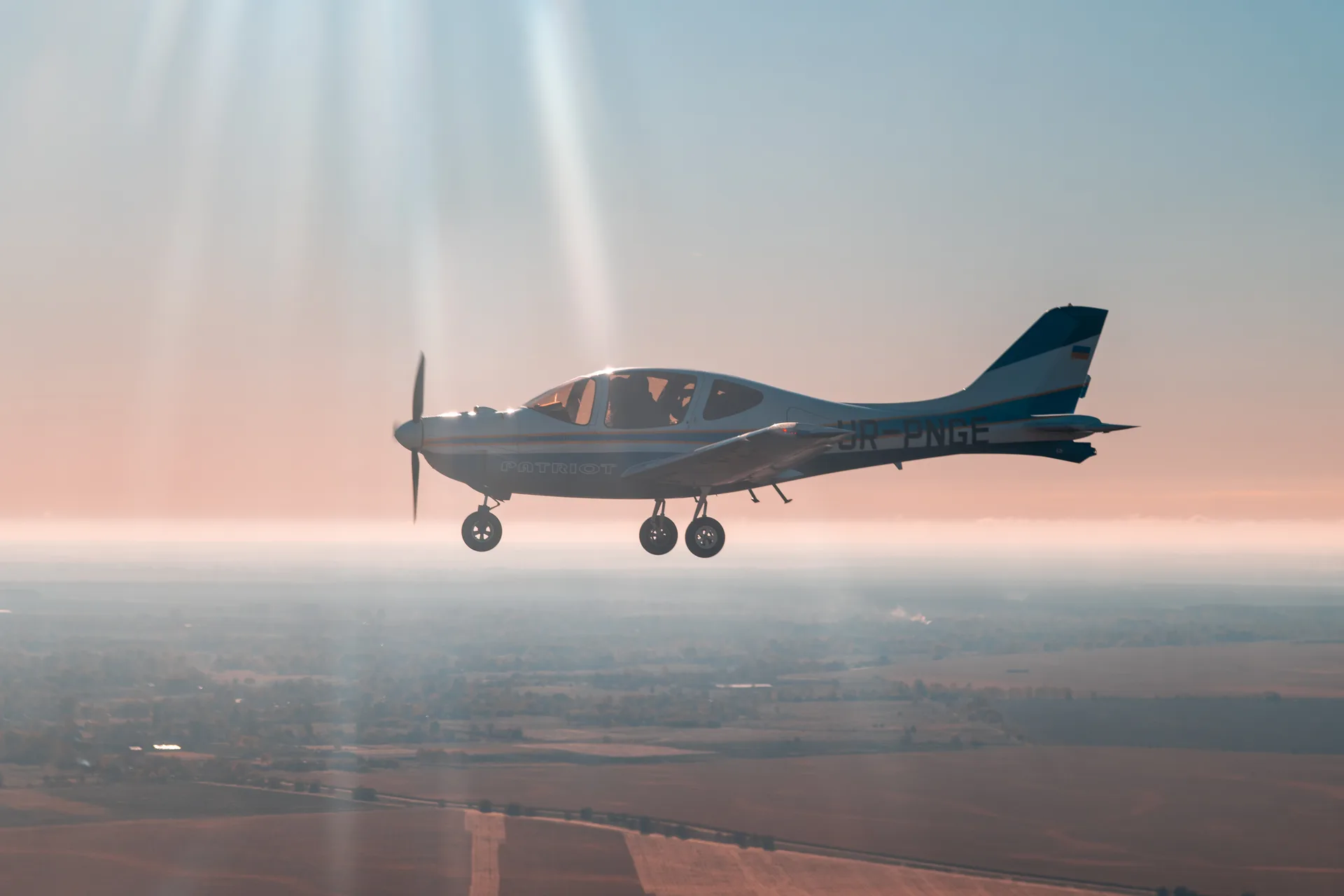 ANG flying into the sun over open fields